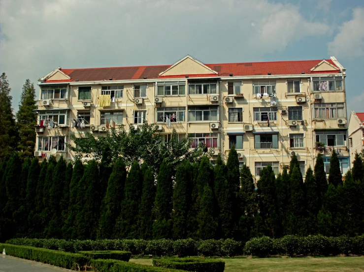 large buildings next to an unpaved parking lot