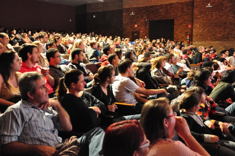 the large audience at the conference is waiting to hear