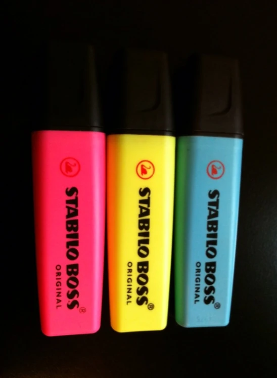 four small lighters on a black background