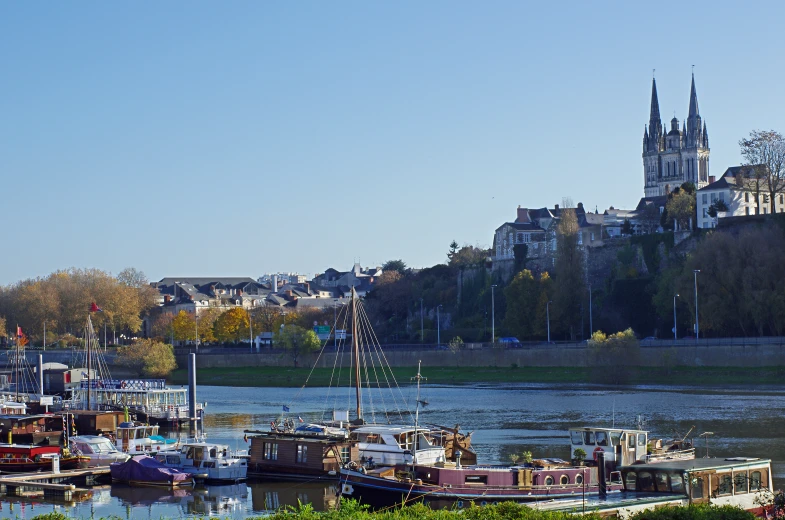 several boats in the water near some buildings