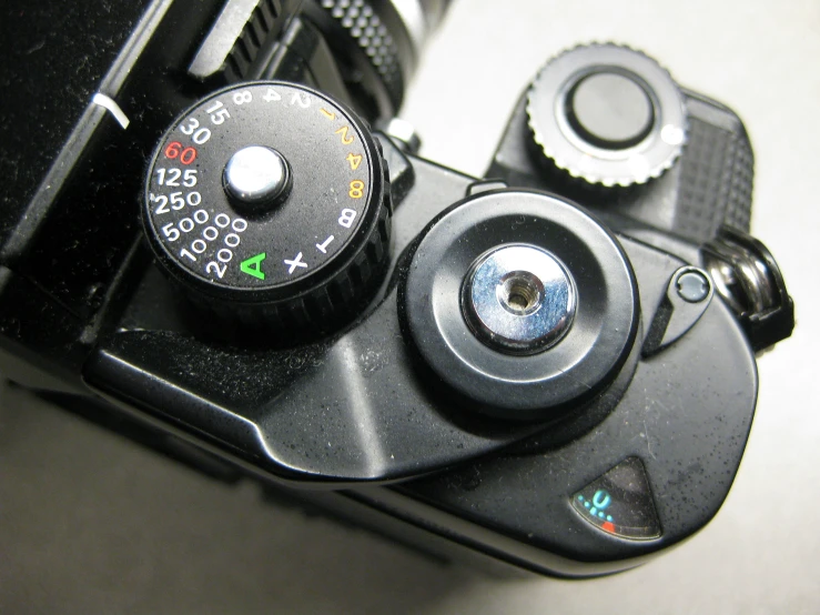 two different angles of the front and back of an analog camera