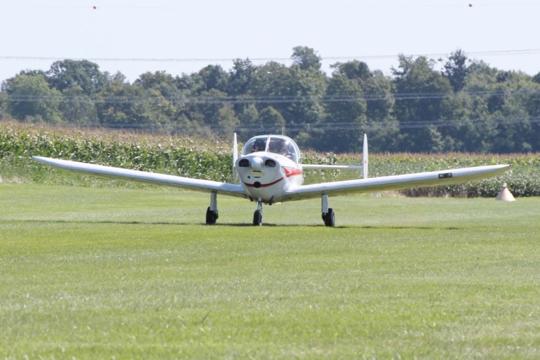 a small plane in motion on the runway