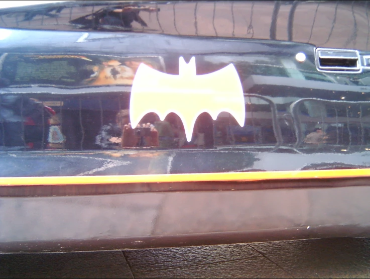 a reflection of a batman car through a window