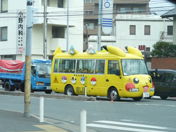 a yellow bus is in the middle of traffic