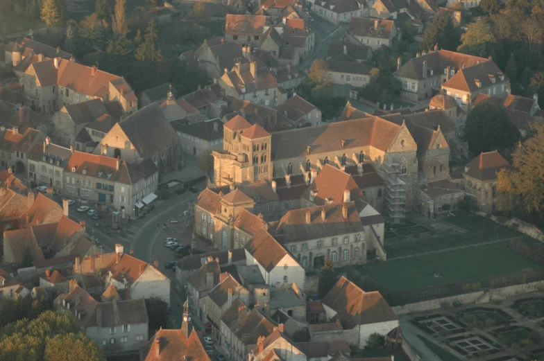 an aerial po of a town surrounded by large buildings