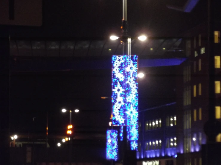 a tall street light sitting under a streetlight