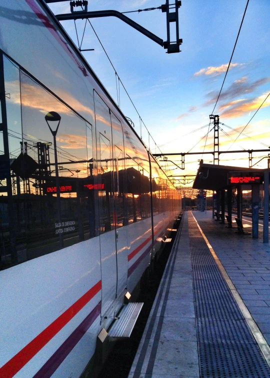 a po taken from a window of a train at sunset