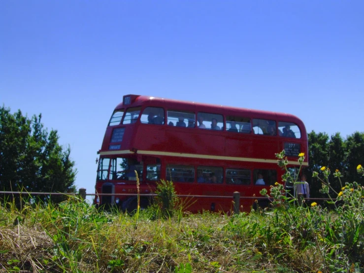 the two level bus is on its own side of a track