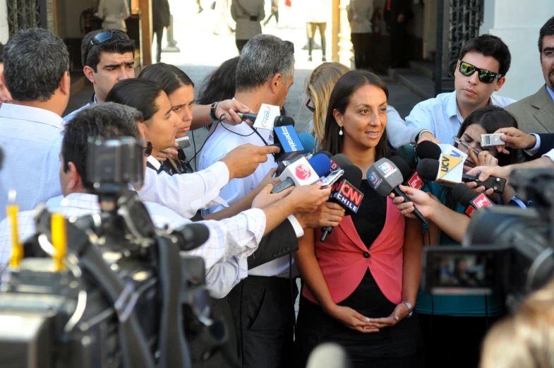 a group of people in front of microphones