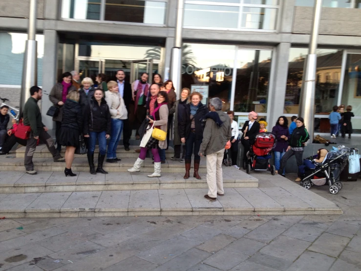 a crowd of people are walking down stairs