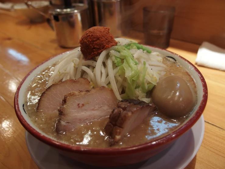 soup with vegetables and pork is in a bowl