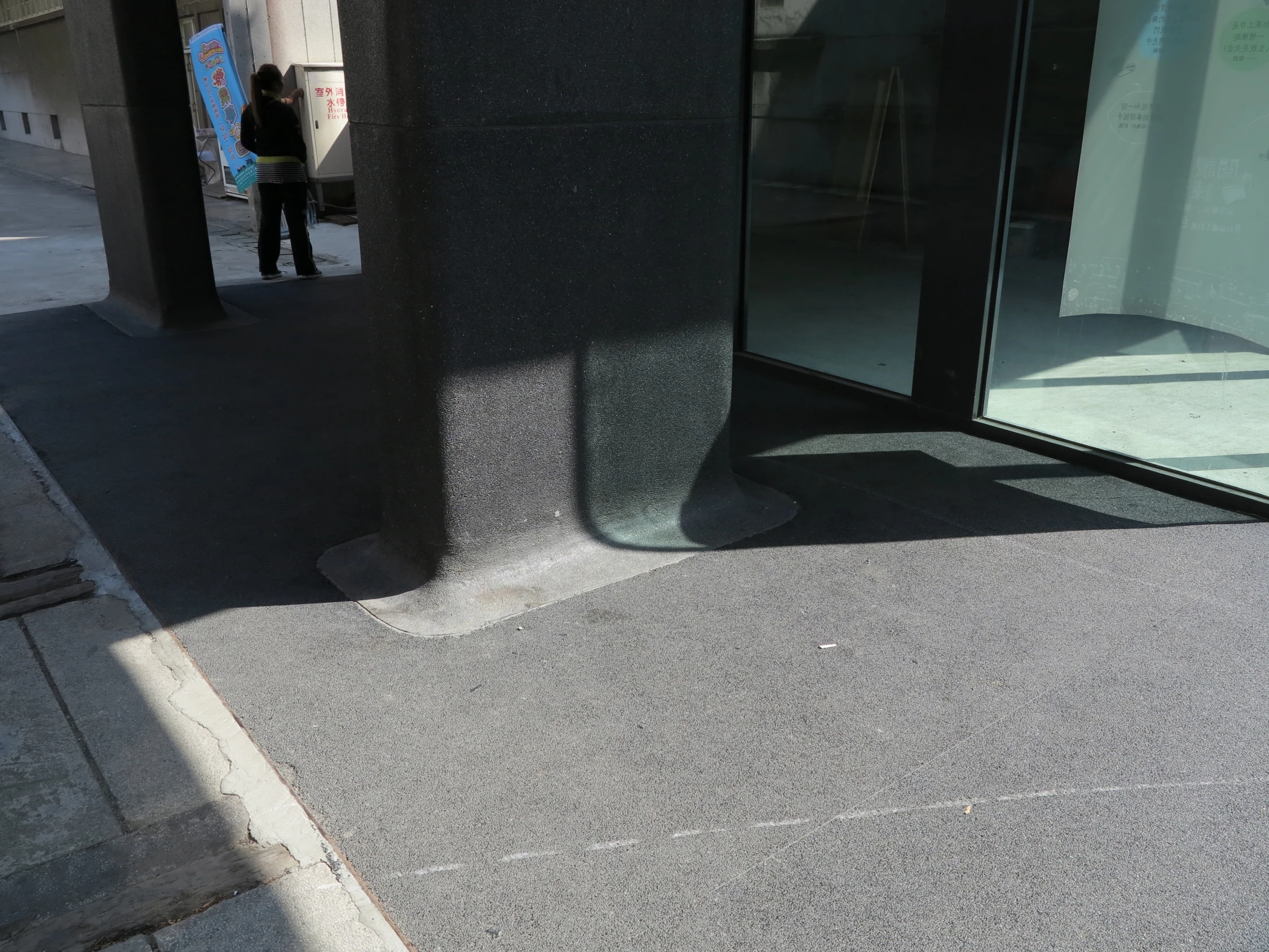 a sidewalk has a closed door on it