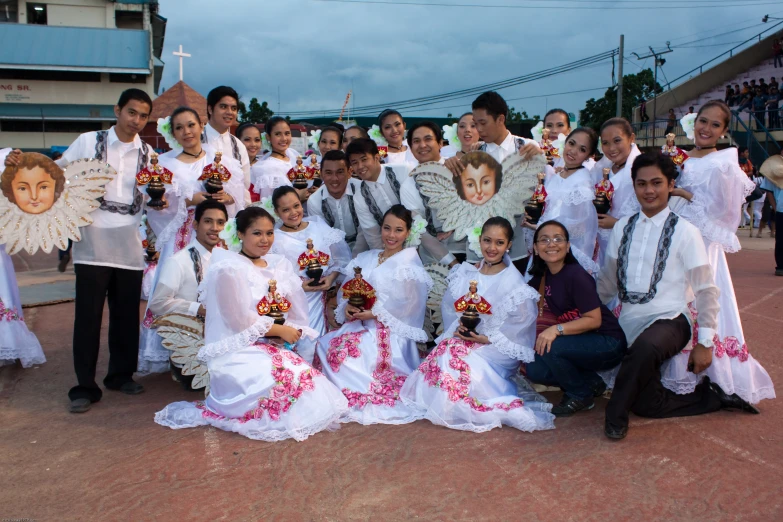 a group of people standing around each other