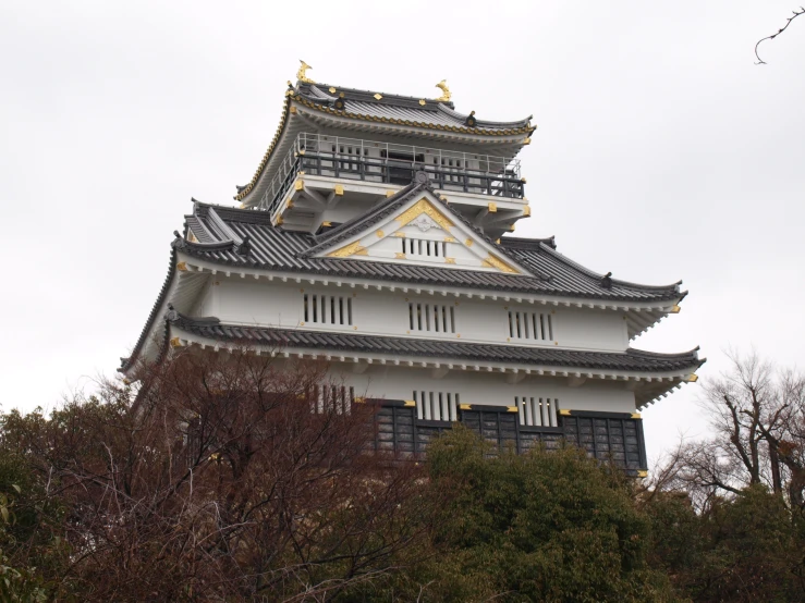 the top part of a building with a tower on it