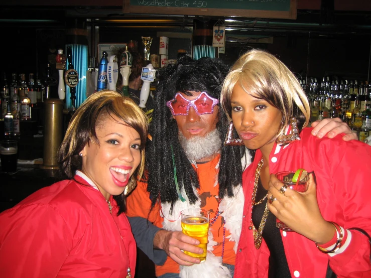 three friends dressed up and drinking orange juice