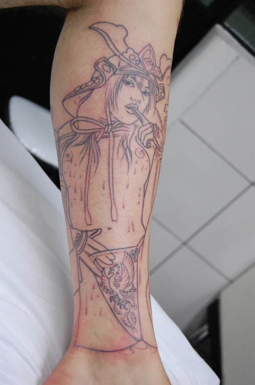 a person with a tattoo on his arm