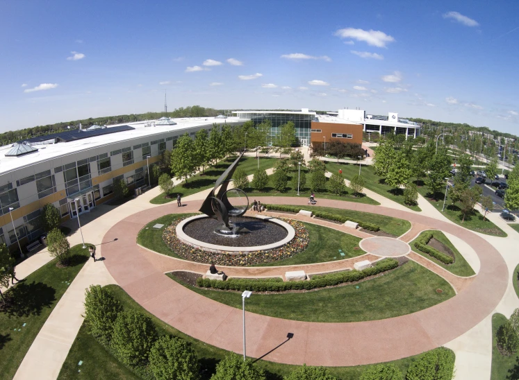 a cam with large circular garden area and clock