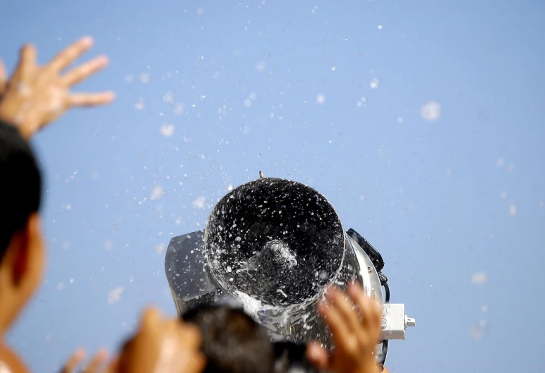 a person covered in snow flying up into the sky