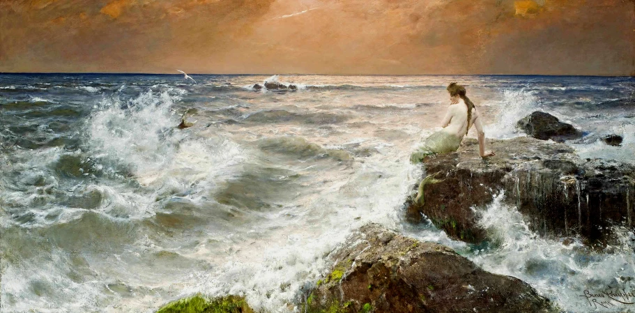 a woman standing on a rock next to the ocean