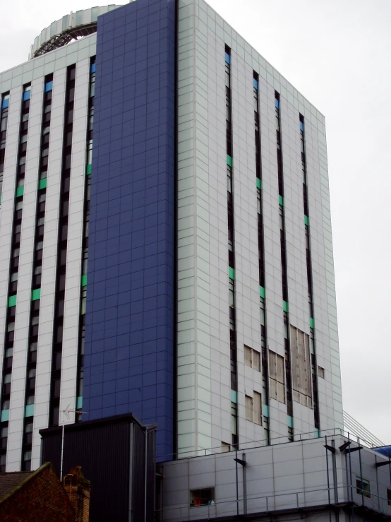 large multicolored building on a gray cloudy day