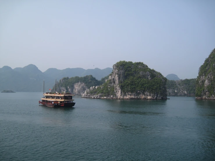 a boat floating on top of a large body of water