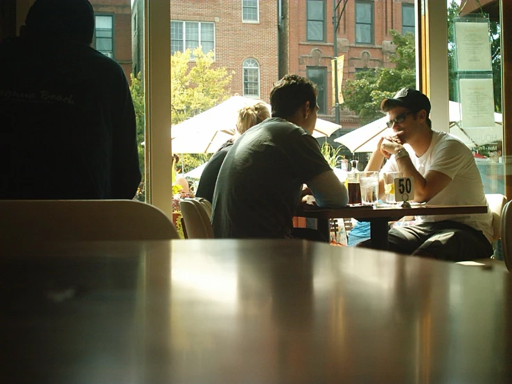 a few people that are sitting at tables together