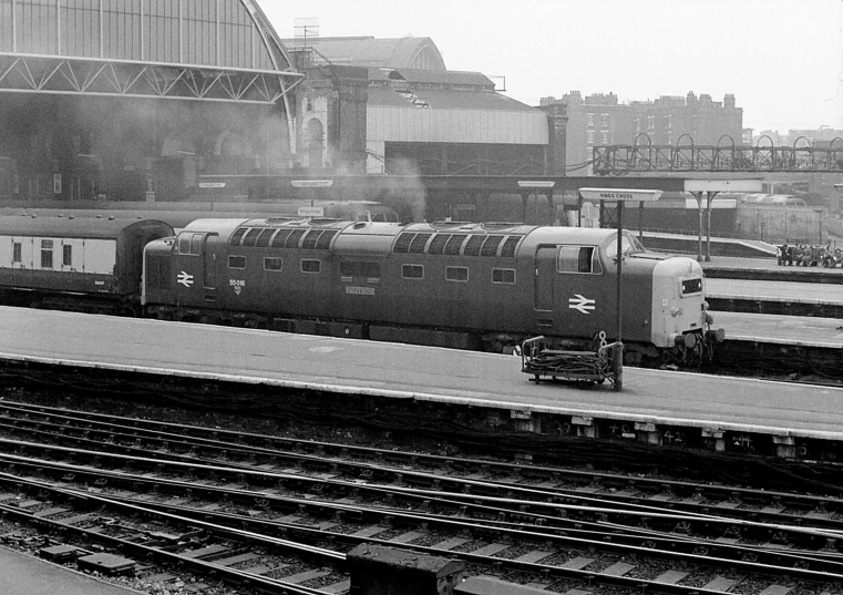 a black and white po of a train at a train station