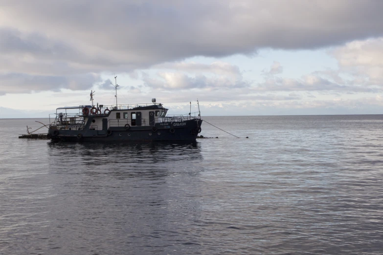 a boat floating on top of a body of water