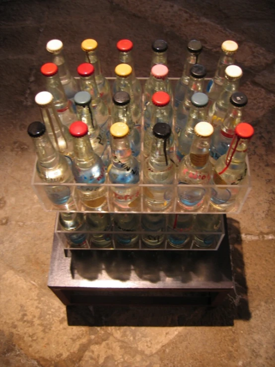 an arrangement of bottles on display on a shelf