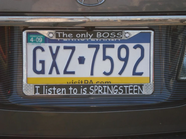 a car plate that has been modified to say gx7 - 7392 and then it is written in white