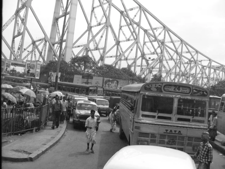 buses are stopped at the stop to pick up passengers