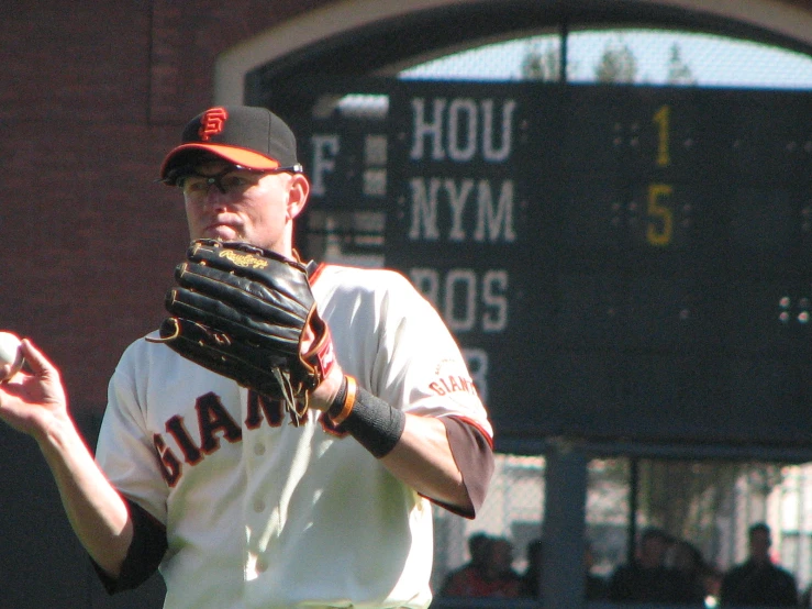 a professional baseball player is making a pitch