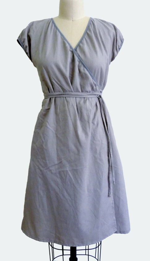 grey linen dress with short sleeves and a side tie on the front