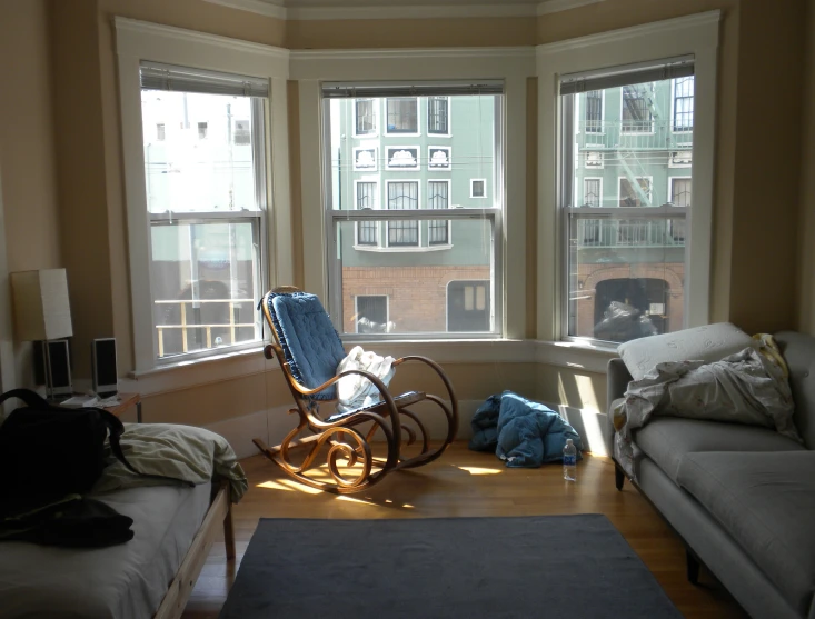 a rocking chair on the floor in a living room