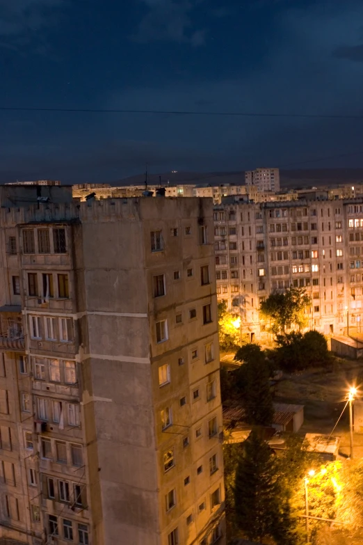 an urban area with many tall buildings at night