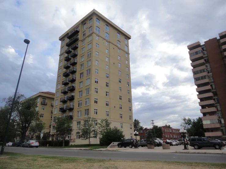 a street scene with a tall building in the background