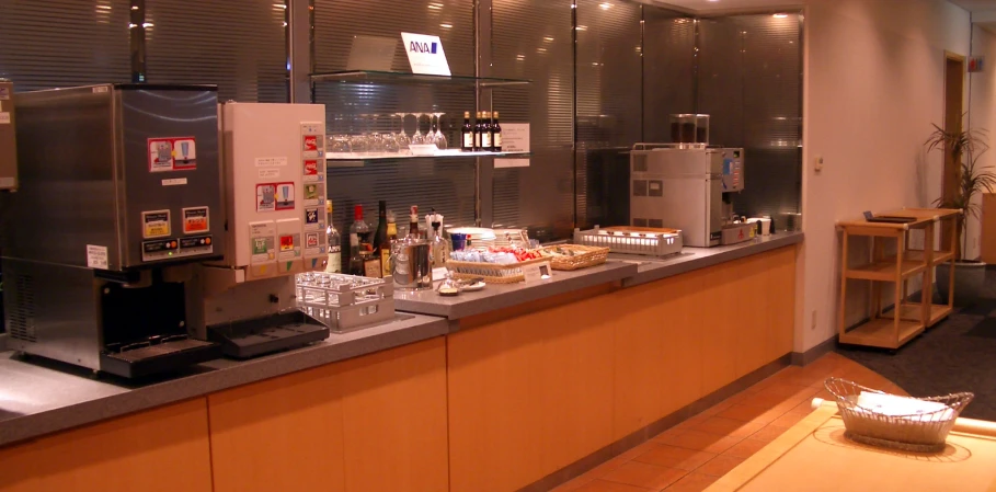 a coffee bar with shelves filled with items