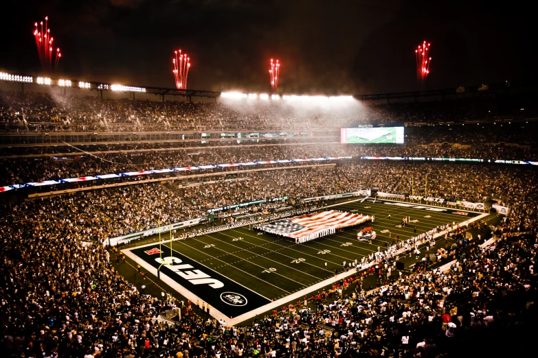 an aerial view of a stadium with fireworks and lights