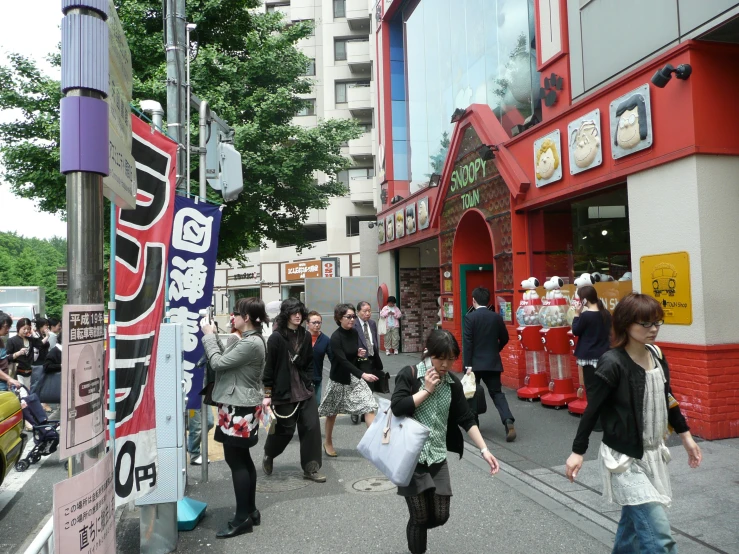 a group of people that are walking in the street