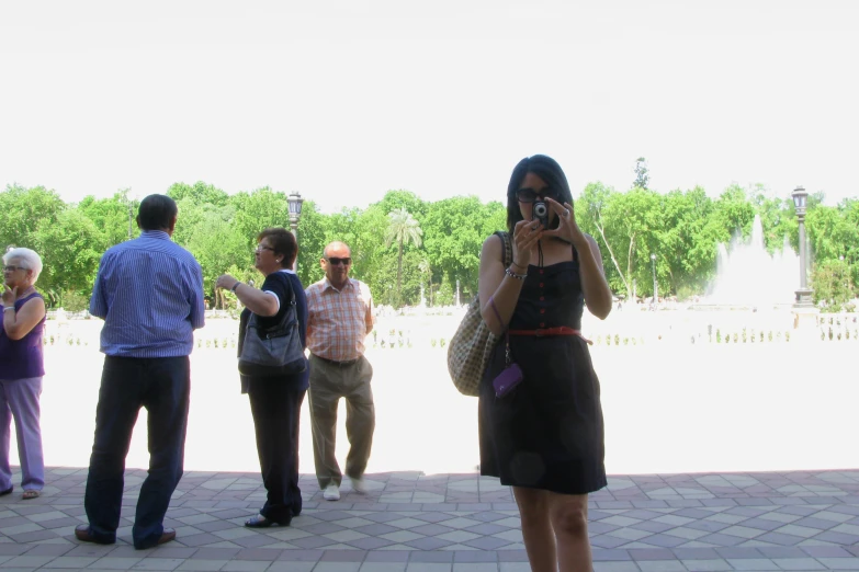 a group of people standing around one another