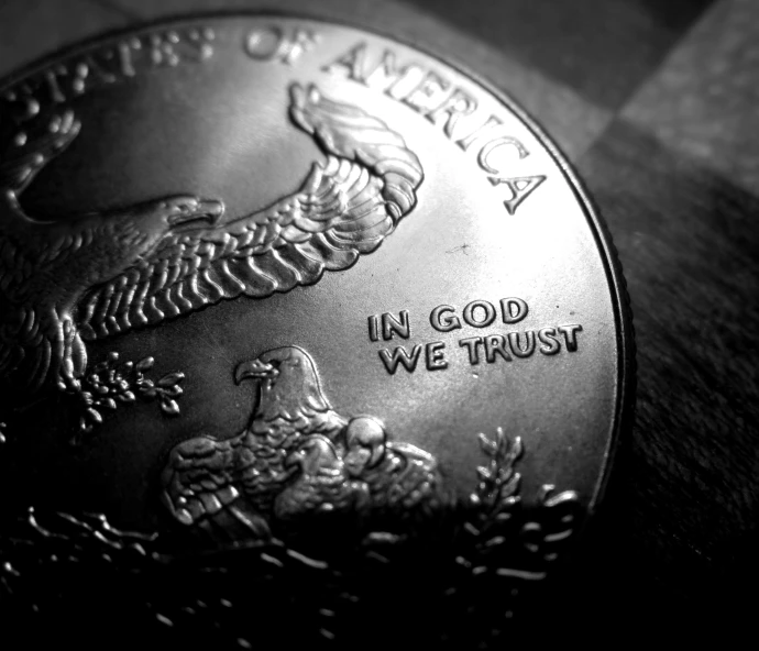 closeup of a united states coin with the message in god we trust on it