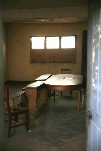 some empty tables are shown next to chairs