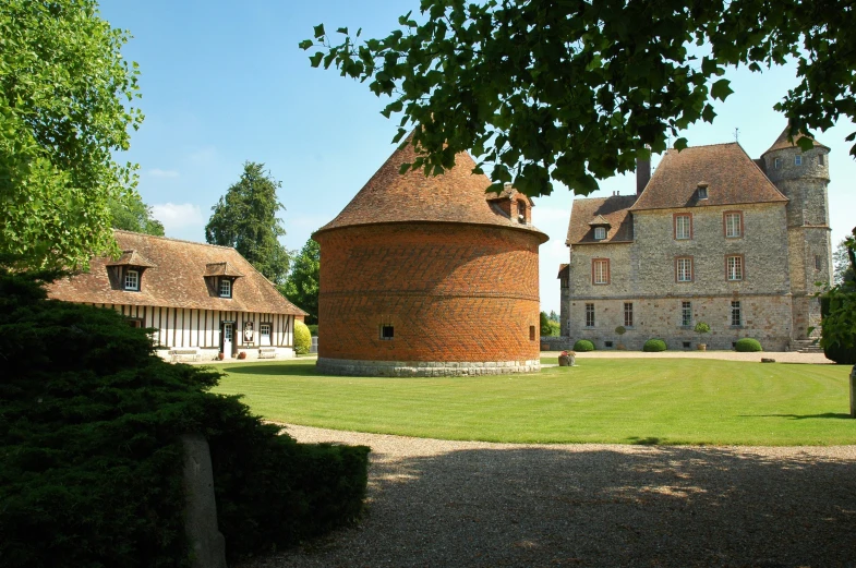 a tower house with a few trees around it