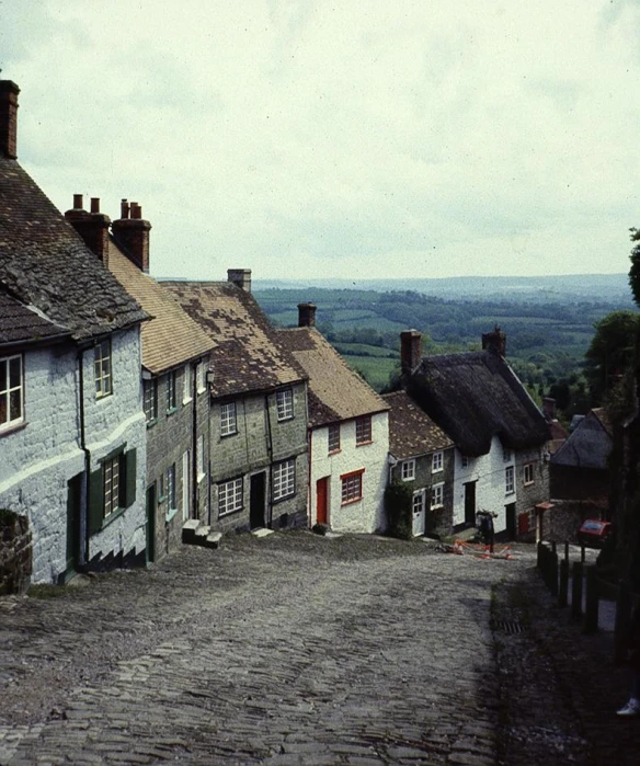 many white buildings sitting on the side of a road