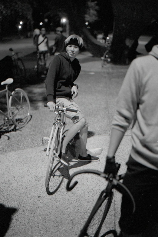 a man riding a bicycle down the middle of a road