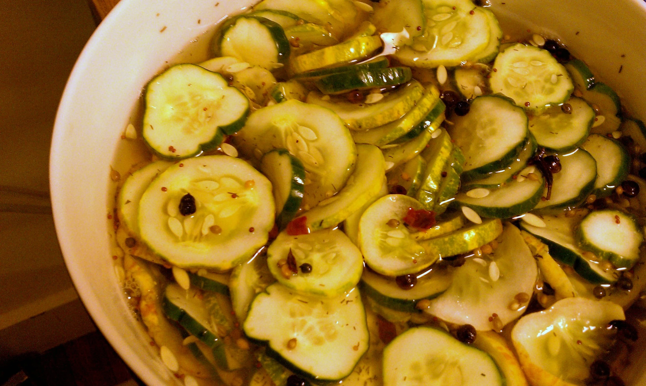 the pan is full of pickles and sauce