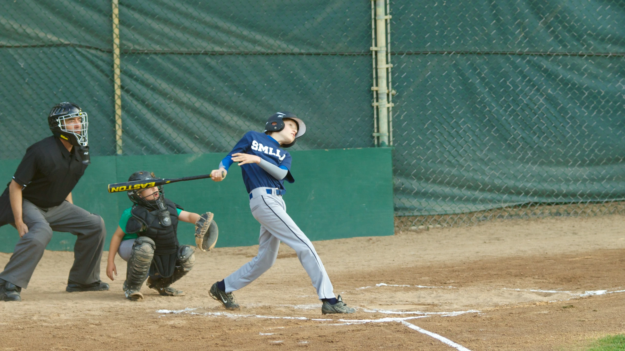 a man is playing baseball at a game