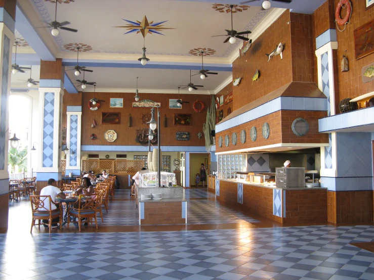 a cafeteria style that has a lot of tables and chairs