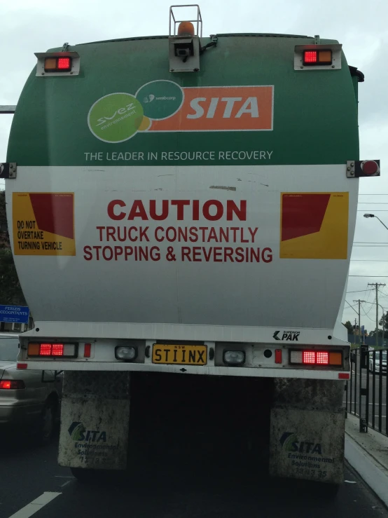 a large truck moving along the road at an intersection