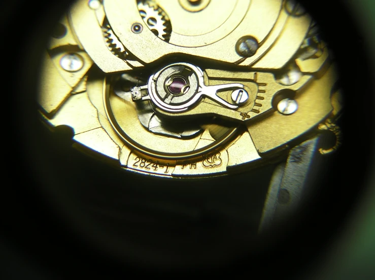 an open mechanical watch movement in focus